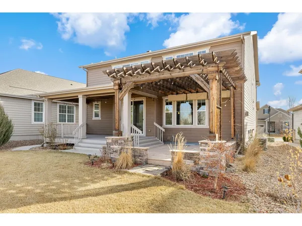 a view of swimming pool with an outdoor seating