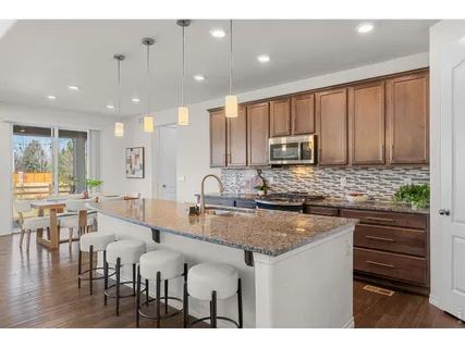a kitchen with lots of counter space and window