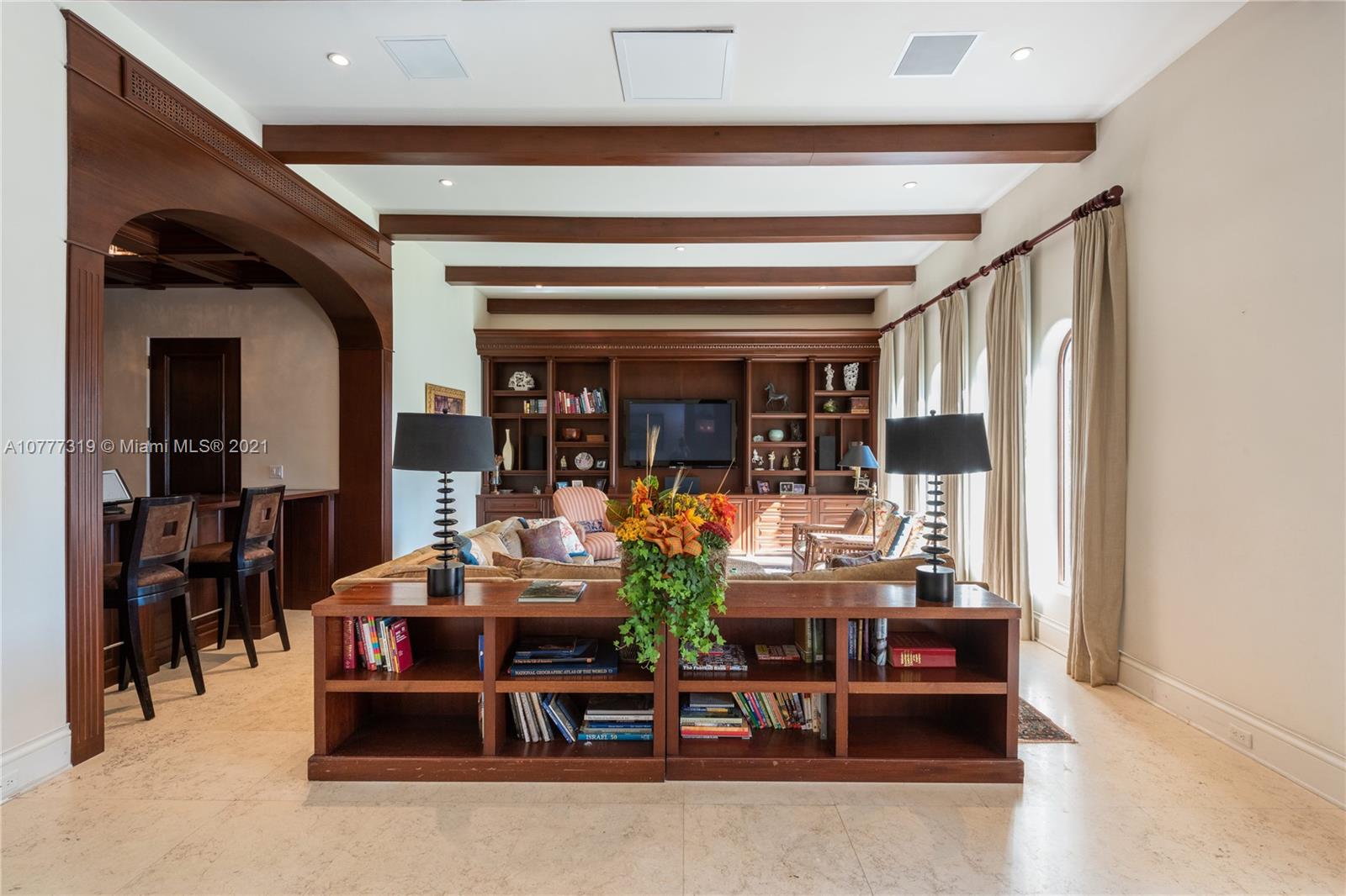 714 Lakeview Drive Miami Beach, FL 33140 - Photo 3 of 3 a living room with furniture and a large window