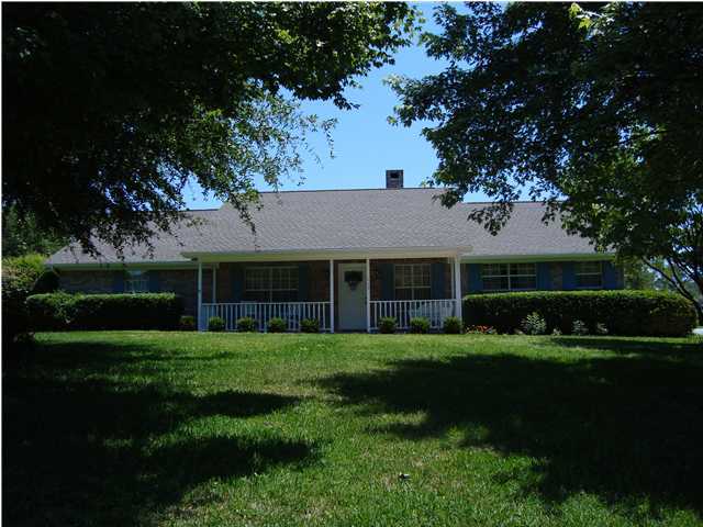 515 Ridge Lake Road Crestview, FL 32536 - Photo 3 of 25 a front view of a house with a garden