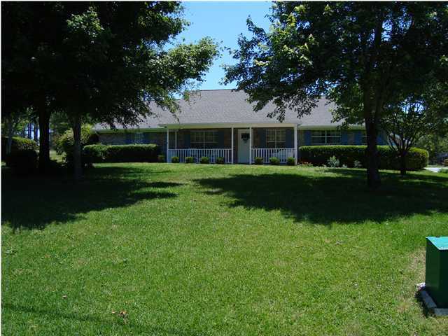 515 Ridge Lake Road Crestview, FL 32536 - Photo 4 of 25 a front view of a house with a yard and trees