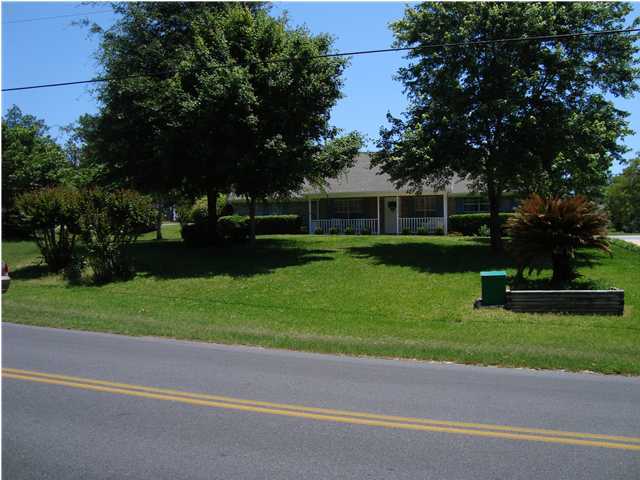 515 Ridge Lake Road Crestview, FL 32536 - Photo 5 of 25 a front view of a house with a yard