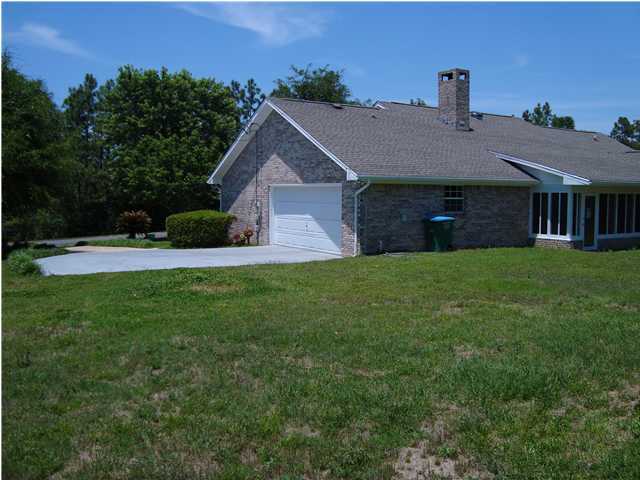 515 Ridge Lake Road Crestview, FL 32536 - Photo 8 of 25 a view of a house with a yard