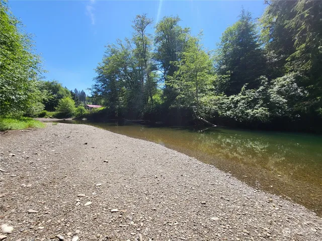a view of a lake with a yard