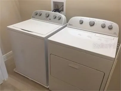 a utility room with dryer and washer