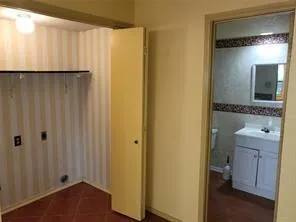 a bathroom with a shower and a sink