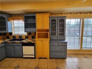 a kitchen with a sink and a stove