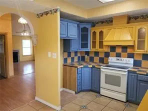 a kitchen with stainless steel appliances granite countertop a stove and a refrigerator