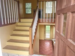 a view of staircase with large window
