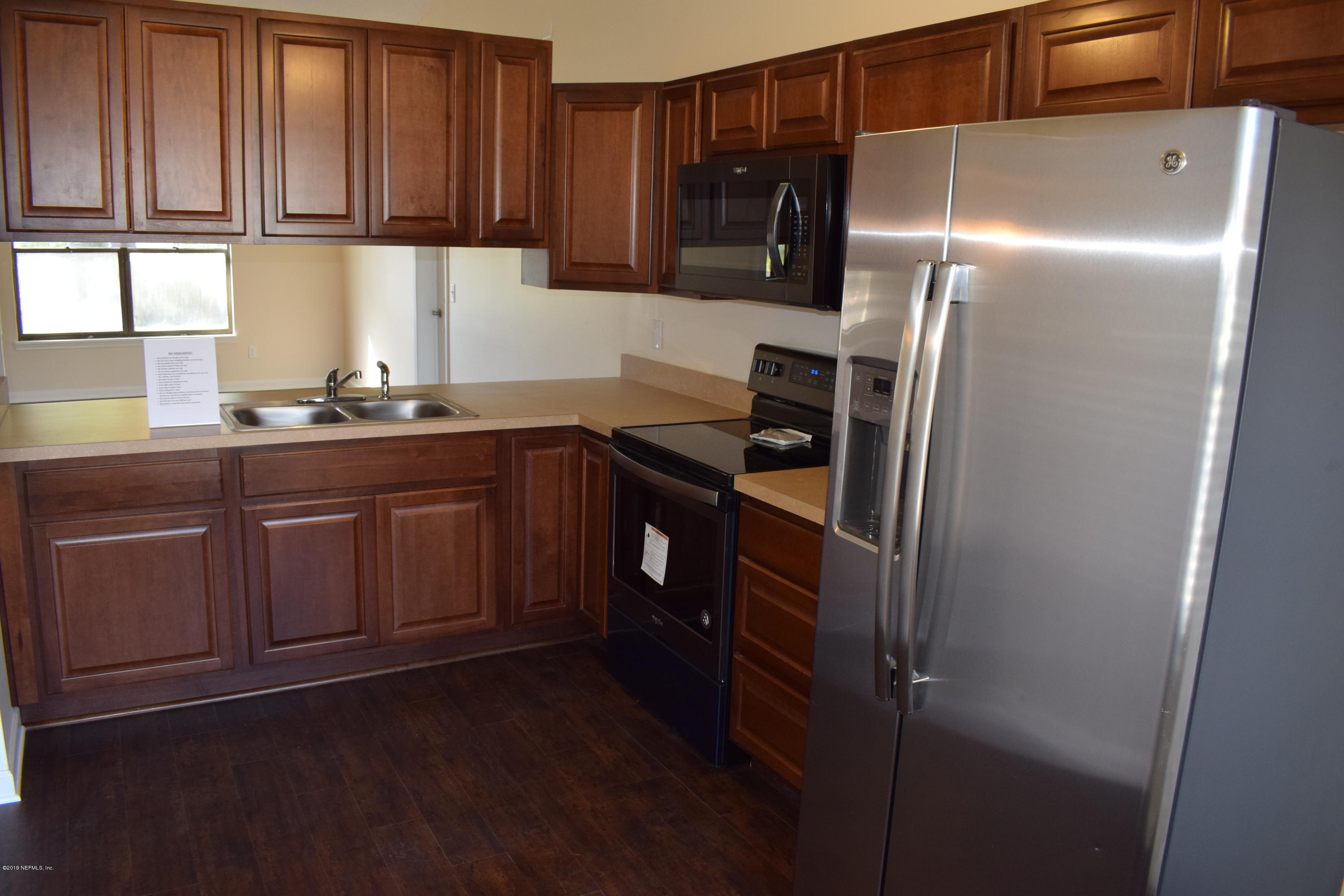 3422 Ricky Court Jacksonville, FL 32223 - Photo 3 of 10 a kitchen with stainless steel appliances granite countertop a refrigerator and a sink