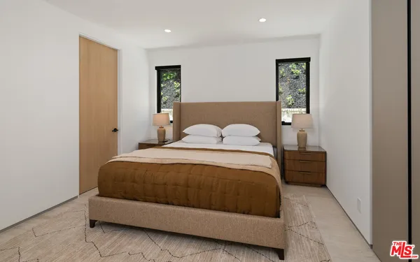 a bed room with a bed and a television