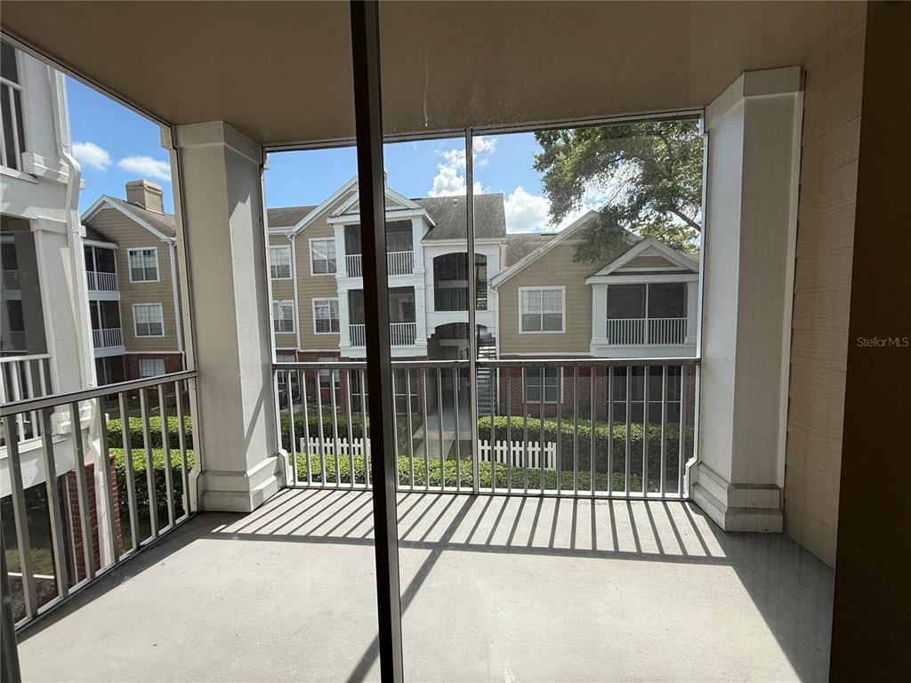 Undisclosed Address Orlando, FL 32821 - Photo 13 of 23 a view of a brick house with large windows and a table