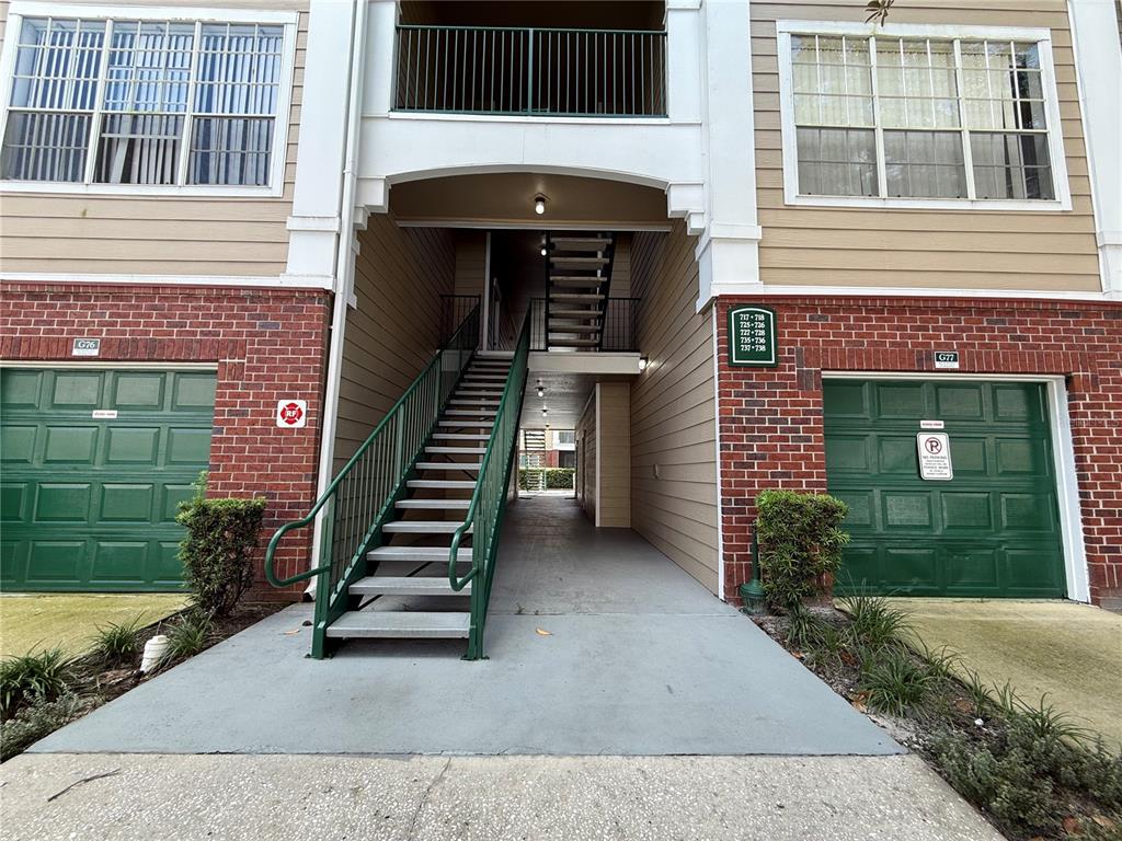 Undisclosed Address Orlando, FL 32821 - Photo 14 of 23 a front view of a house with a yard