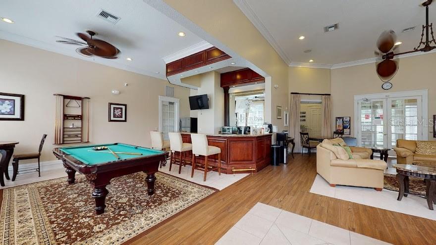 Undisclosed Address Orlando, FL 32821 - Photo 19 of 23 a living room with furniture a rug and a flat screen tv