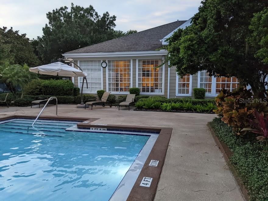 Undisclosed Address Orlando, FL 32821 - Photo 20 of 23 a front view of a house with garden