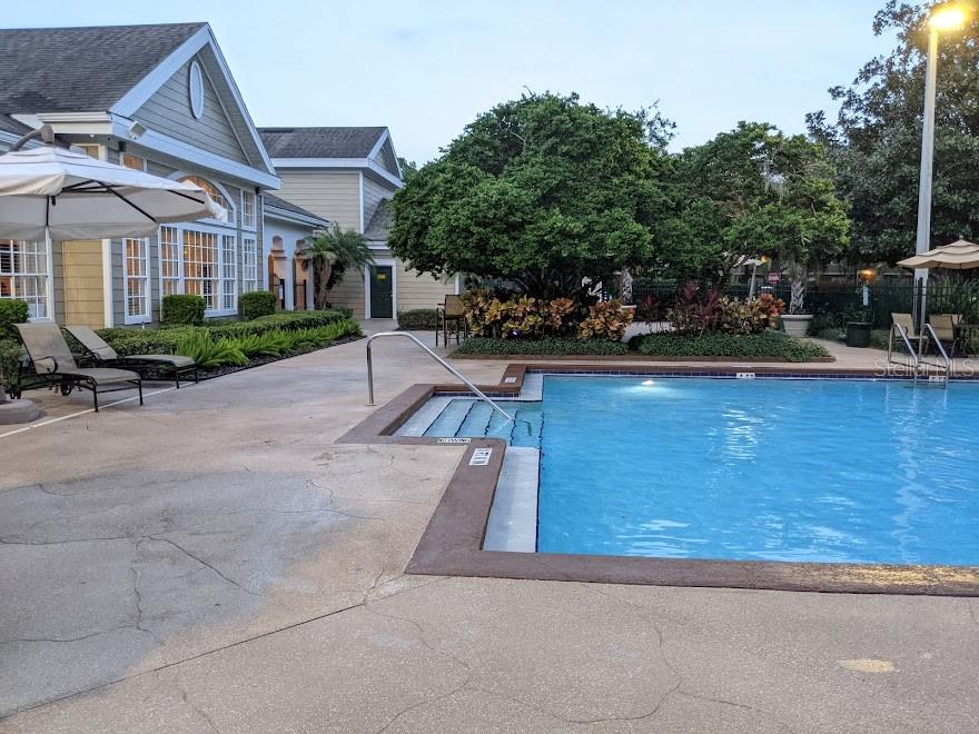 Undisclosed Address Orlando, FL 32821 - Photo 21 of 23 a view of a house with pool