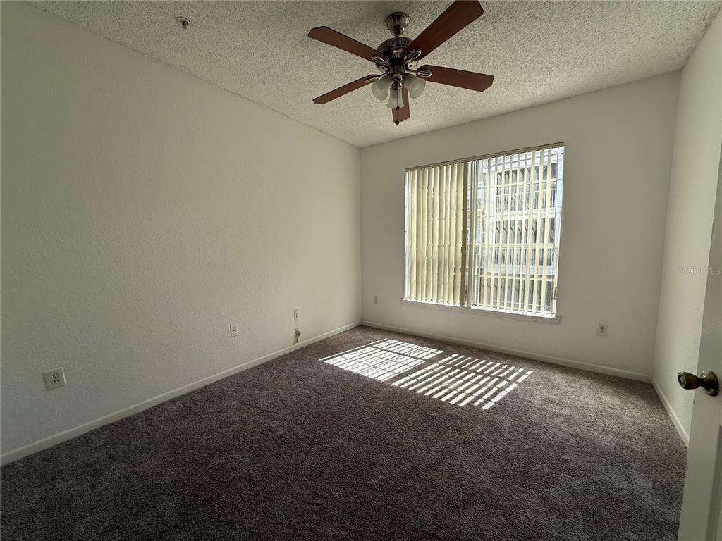 Undisclosed Address Orlando, FL 32821 - Photo 3 of 23 a view of an empty room with a window