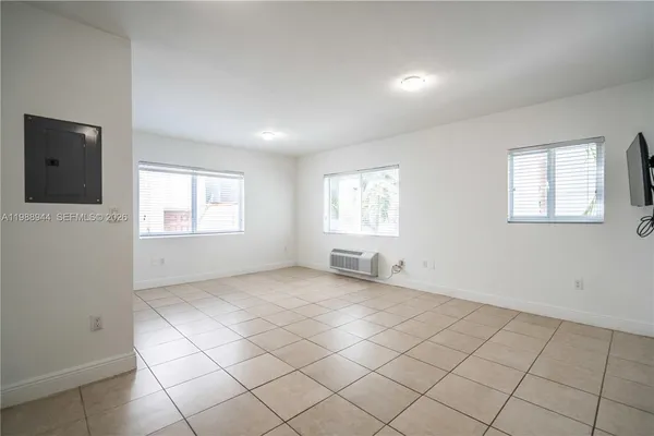 a view of an empty room with a window