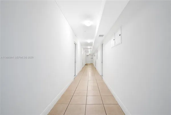 a view of a hallway with a white walls