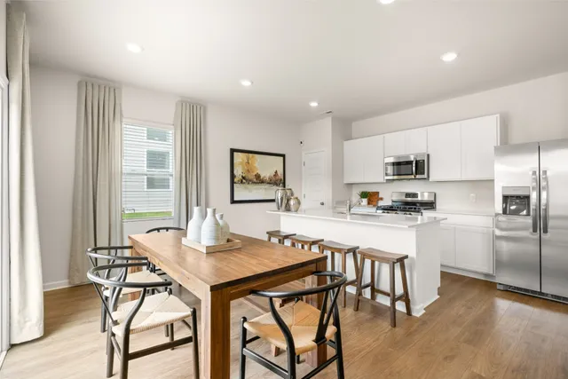 a kitchen with stainless steel appliances a sink a stove top oven a counter space and cabinets