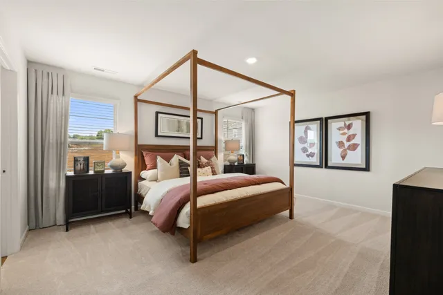 a bedroom with a bed and a dresser