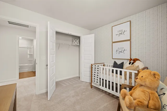 a bedroom with a bed and a dresser