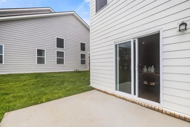 a view of a backyard of the house