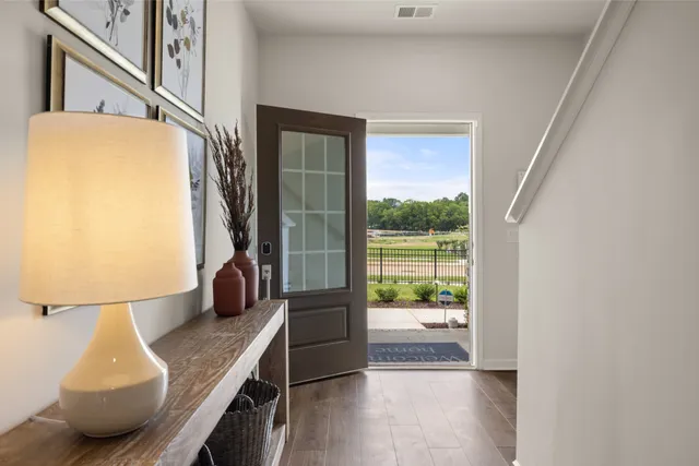 a kitchen with a sink and a refrigerator
