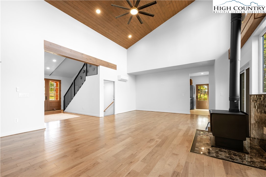 1075 Center Ct Drive Boone, NC 28607 - Photo 11 of 48 a view of an empty room with wooden floor and a ceiling fan