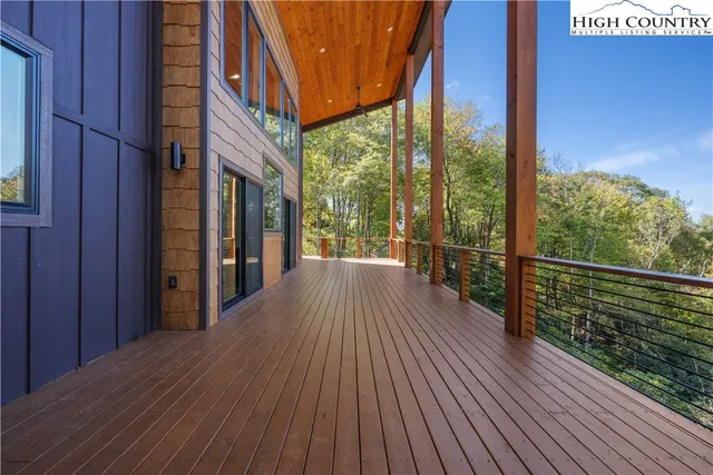 a view of a balcony with wooden floor
