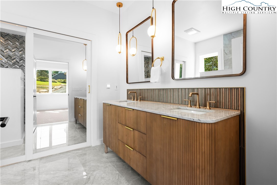 1075 Center Ct Drive Boone, NC 28607 - Photo 23 of 48 a bathroom with a sink and a mirror