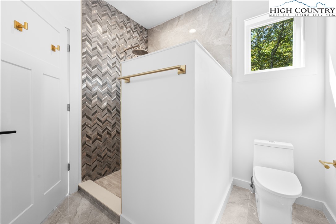 1075 Center Ct Drive Boone, NC 28607 - Photo 24 of 48 a bathroom with a toilet and a shower