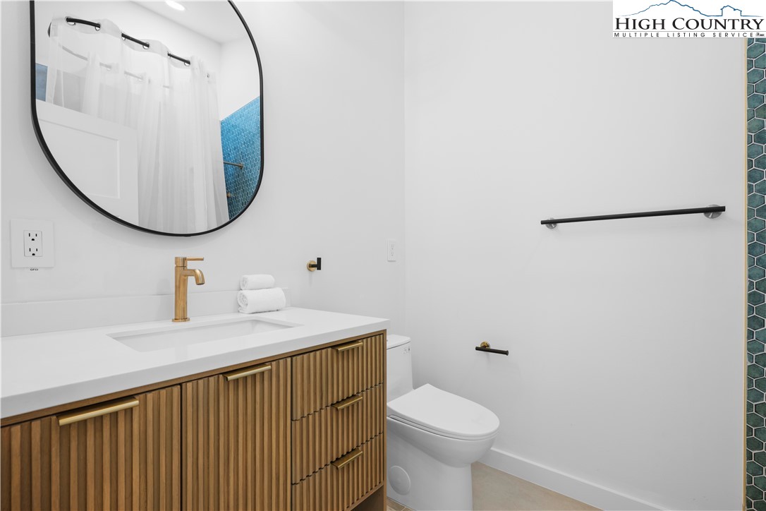 1075 Center Ct Drive Boone, NC 28607 - Photo 28 of 48 a bathroom with a sink and a mirror