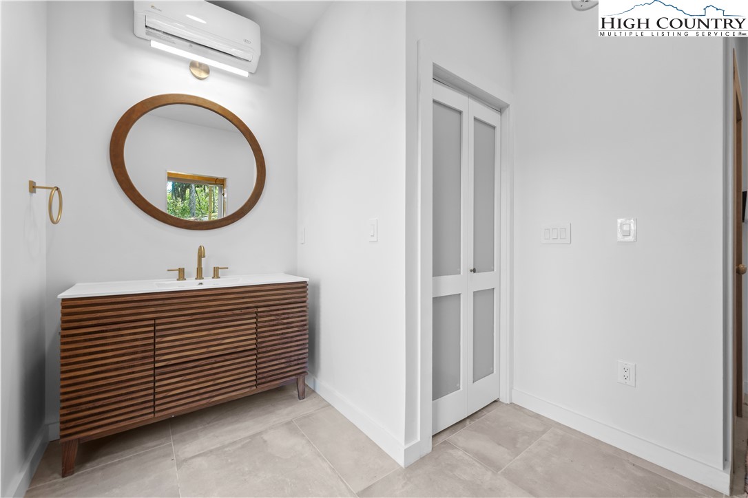 1075 Center Ct Drive Boone, NC 28607 - Photo 37 of 48 a bathroom with a sink and a mirror