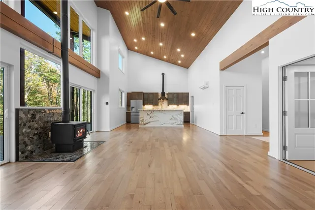 a view of kitchen with furniture and wooden floor