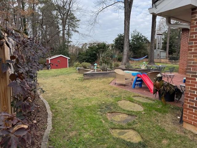 2562 Coralwood Drive Decatur, GA 30033 - Photo 4 of 5 a view of a backyard with a table and chairs