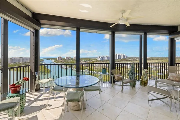 a view of a balcony with furniture