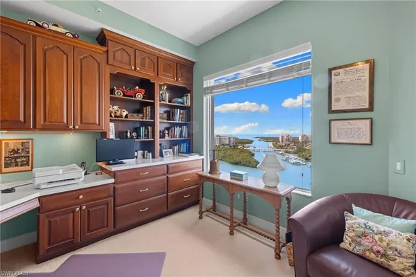 a room with a large window and a couch