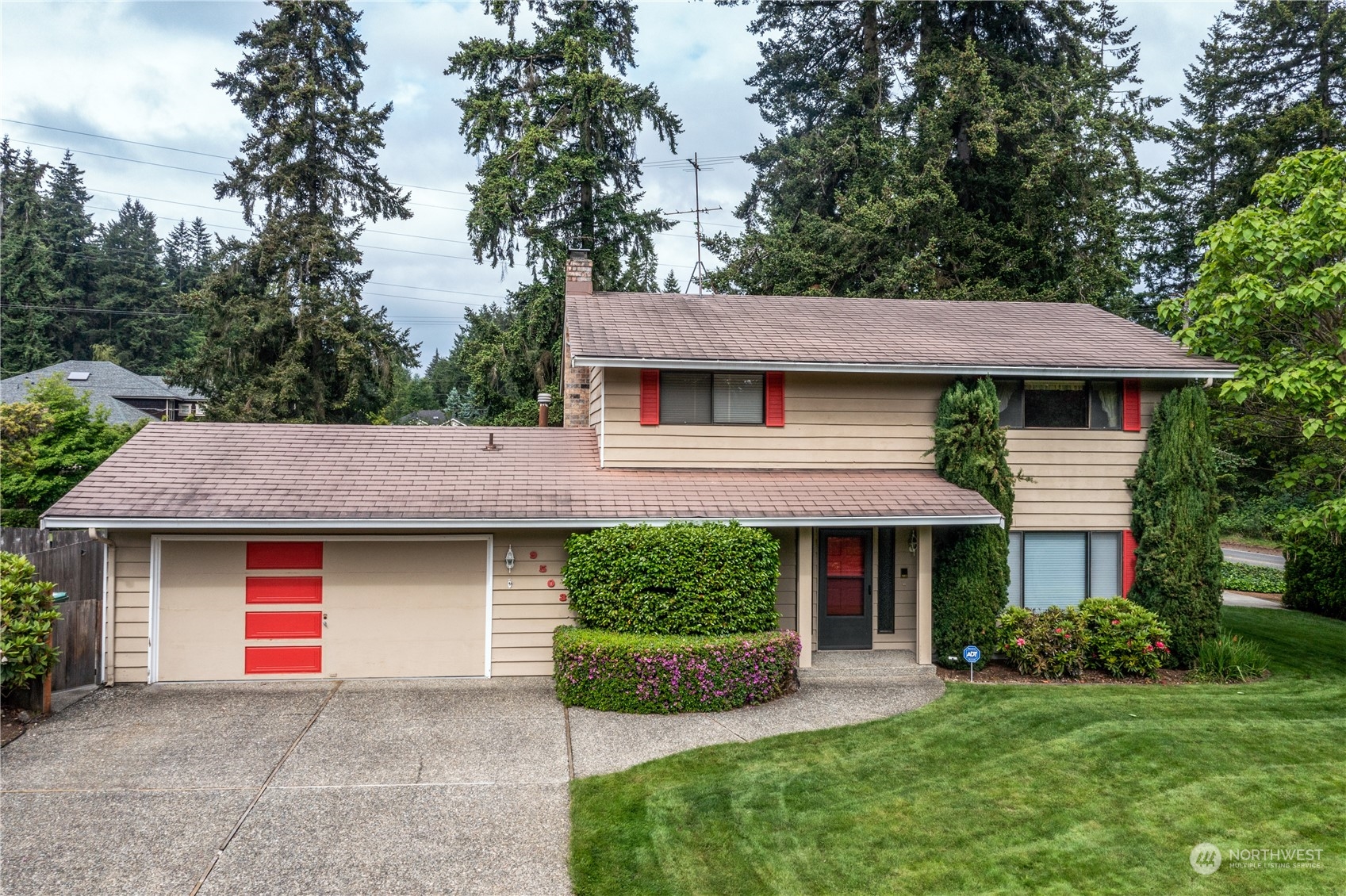 9503 127th Place Southeast Renton, WA 98056 - Photo 1 of 32 a front view of a house with a garden and plants