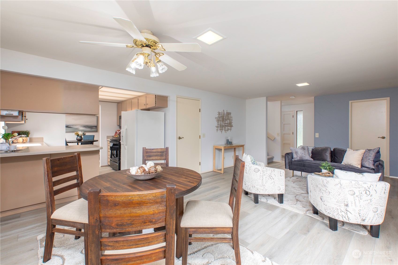 9503 127th Place Southeast Renton, WA 98056 - Photo 11 of 32 a view of a dining room with furniture and wooden floor