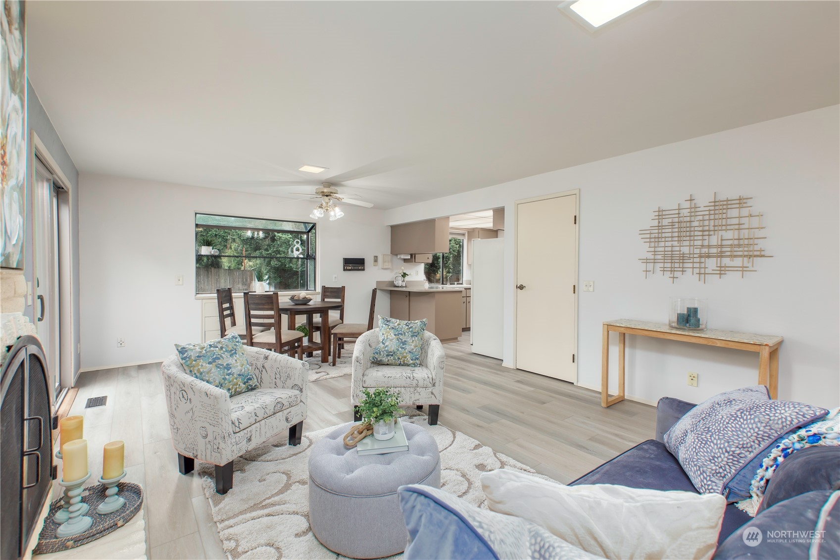 9503 127th Place Southeast Renton, WA 98056 - Photo 14 of 32 a living room with furniture a fireplace and a large window