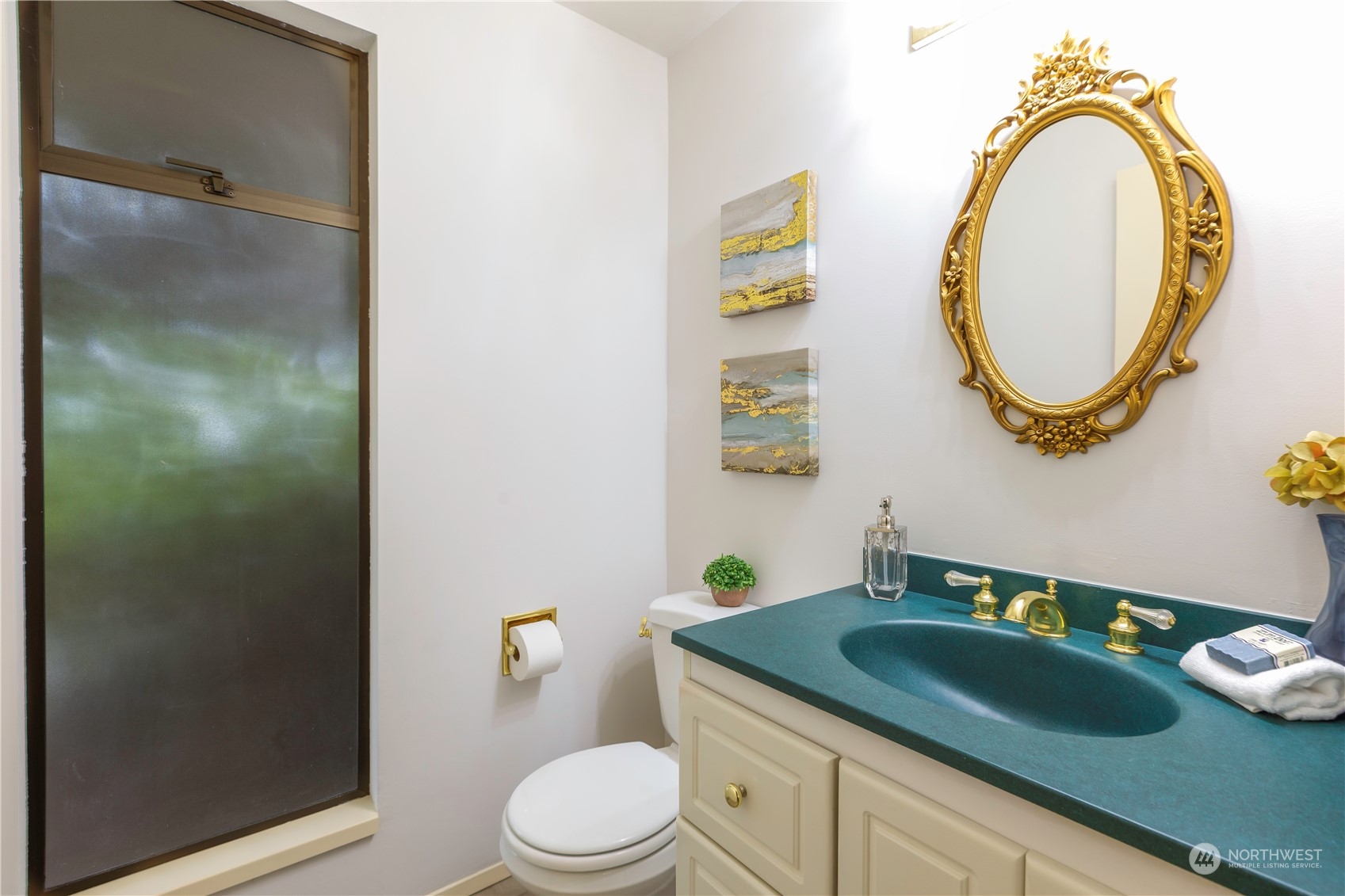 9503 127th Place Southeast Renton, WA 98056 - Photo 15 of 32 a bathroom with a granite countertop toilet and a sink