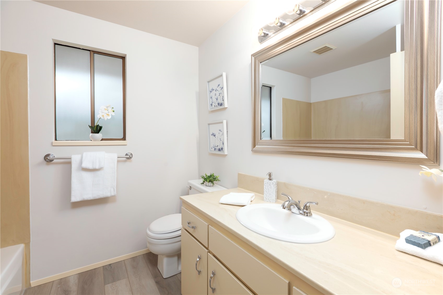 9503 127th Place Southeast Renton, WA 98056 - Photo 20 of 32 a bathroom with a granite countertop toilet sink and mirror