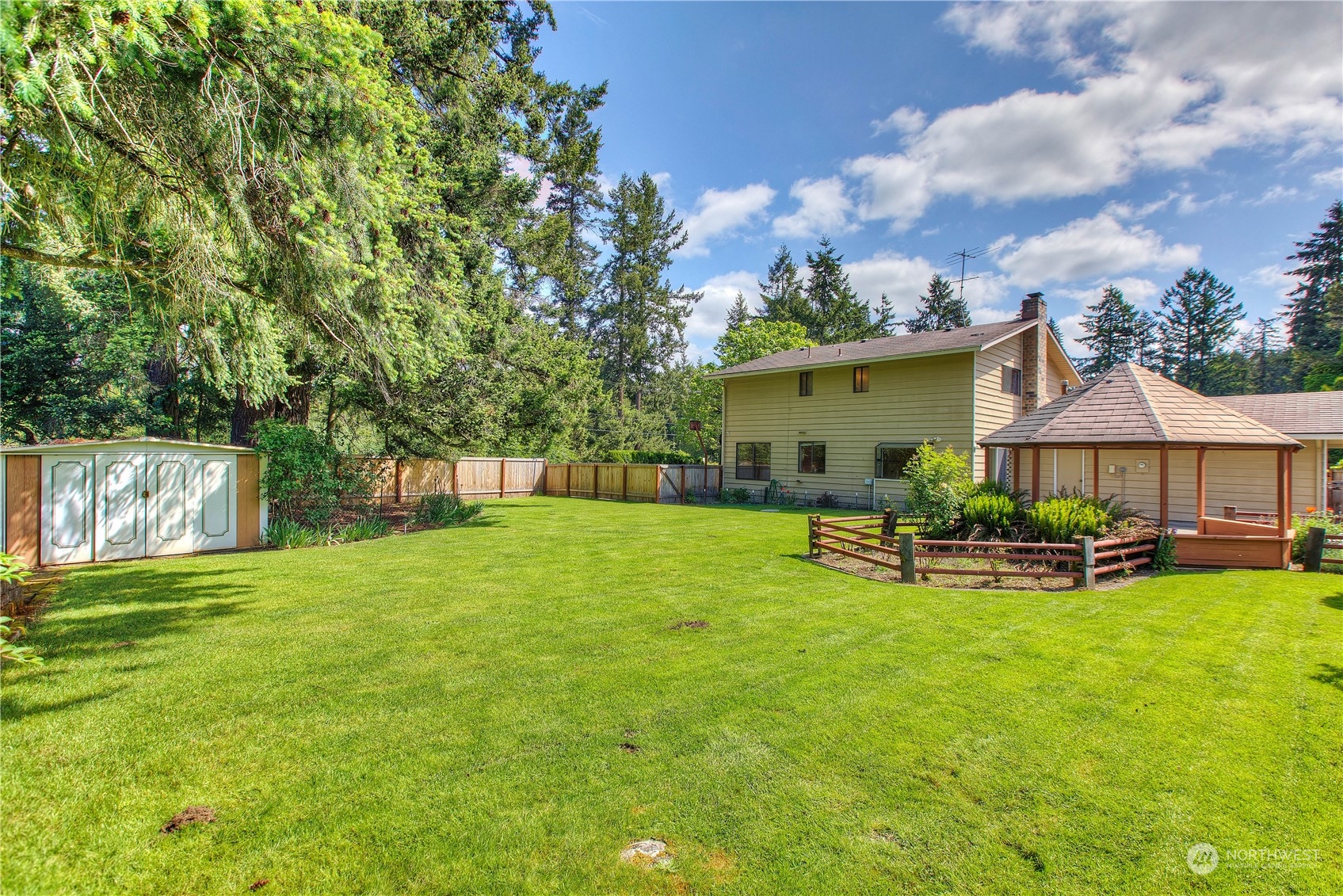 9503 127th Place Southeast Renton, WA 98056 - Photo 24 of 32 a view of a house with backyard and sitting area