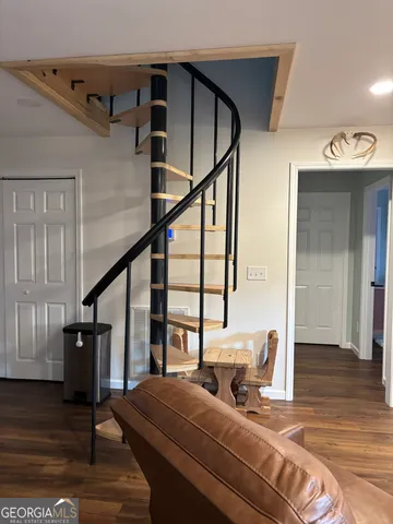 a bedroom with furniture and a window