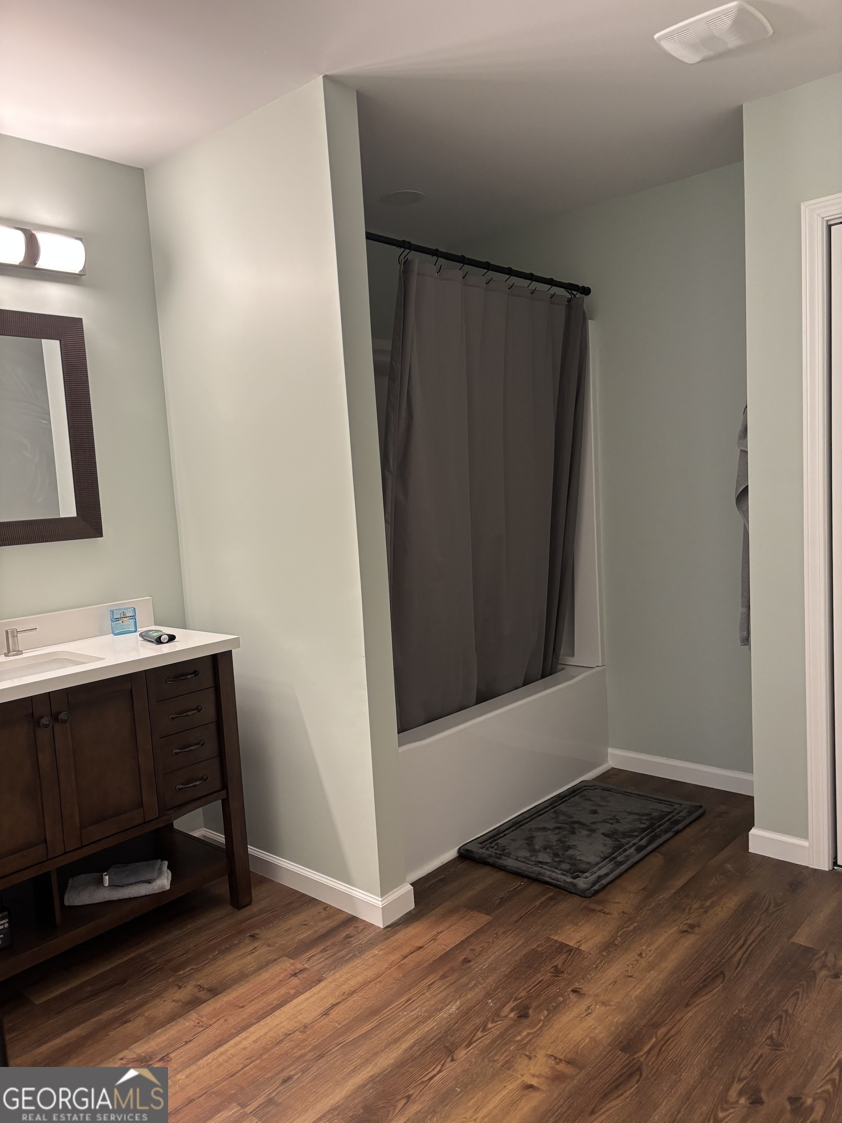 204 6th Avenue Menlo, GA 30731 - Photo 16 of 24 a view of a utility room with wooden floor and mirror