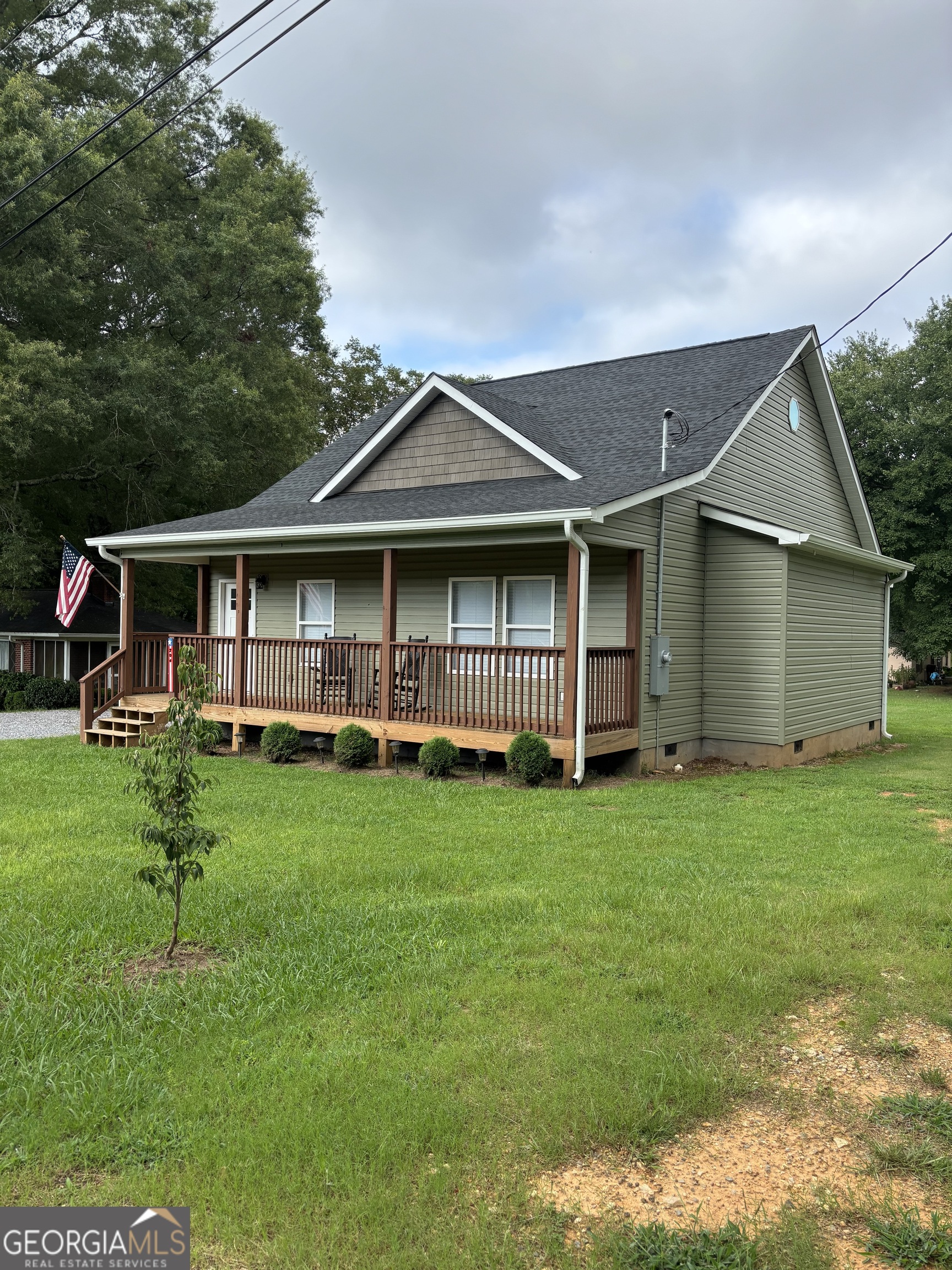 204 6th Avenue Menlo, GA 30731 - Photo 2 of 24 a view of an house with backyard space and balcony