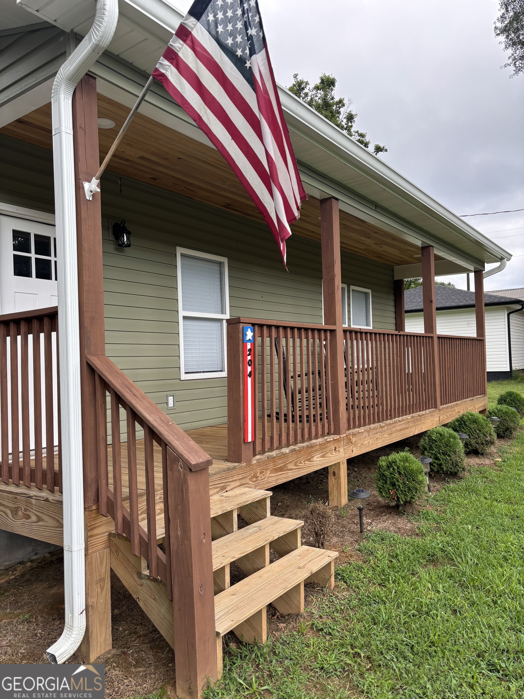 204 6th Avenue Menlo, GA 30731 - Photo 3 of 24 a front view of a house with a yard