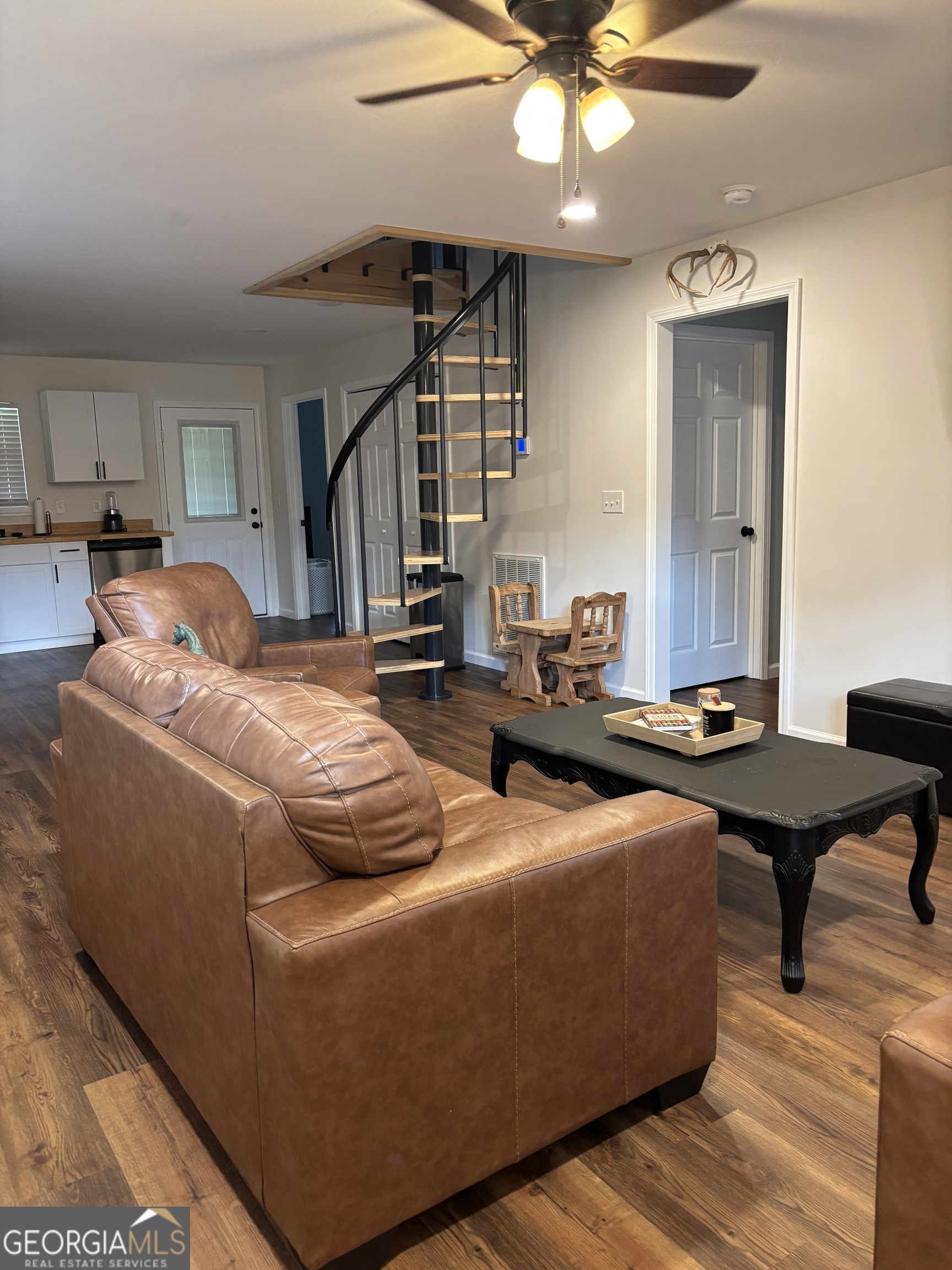 204 6th Avenue Menlo, GA 30731 - Photo 7 of 24 a living room with furniture and a chandelier