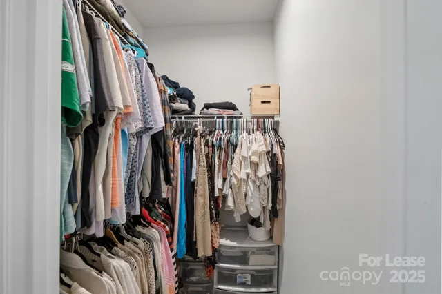 a bathroom with a granite countertop sink a shower and a mirror